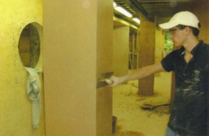 James plastering a pillar