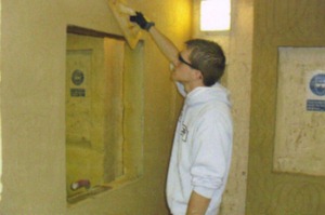 James plastering a serving hatch