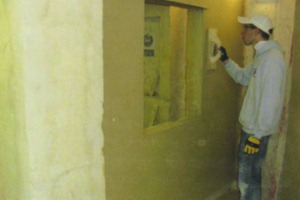 James plastering a serving hatch